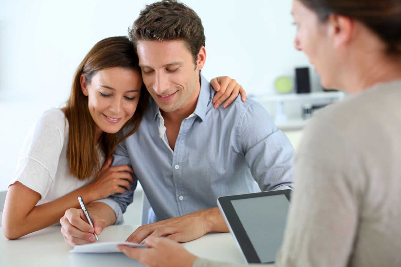 Couple signing real estate contract
